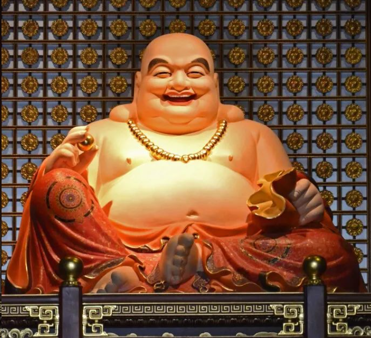 Sitting in the temple, smiling and having a big belly, Maitreya Buddha