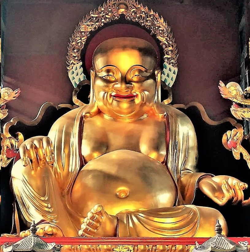 Golden budia monk sitting in temple